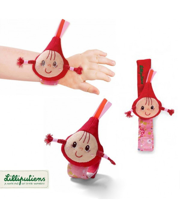 Lilliputiens – Υφασμάτινη κουδουνίστρα – βραχιολάκι Κοκκινοσκουφίτσα Lilliputiens – Υφασμάτινη κουδουνίστρα – βραχιολάκι Κοκκινοσκουφίτσα